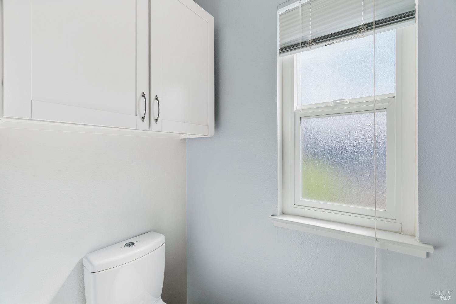 790 Hudis Street Rohnert Park, CA 94928 - Photo 24 of 41 a bathroom with a window and a toilet