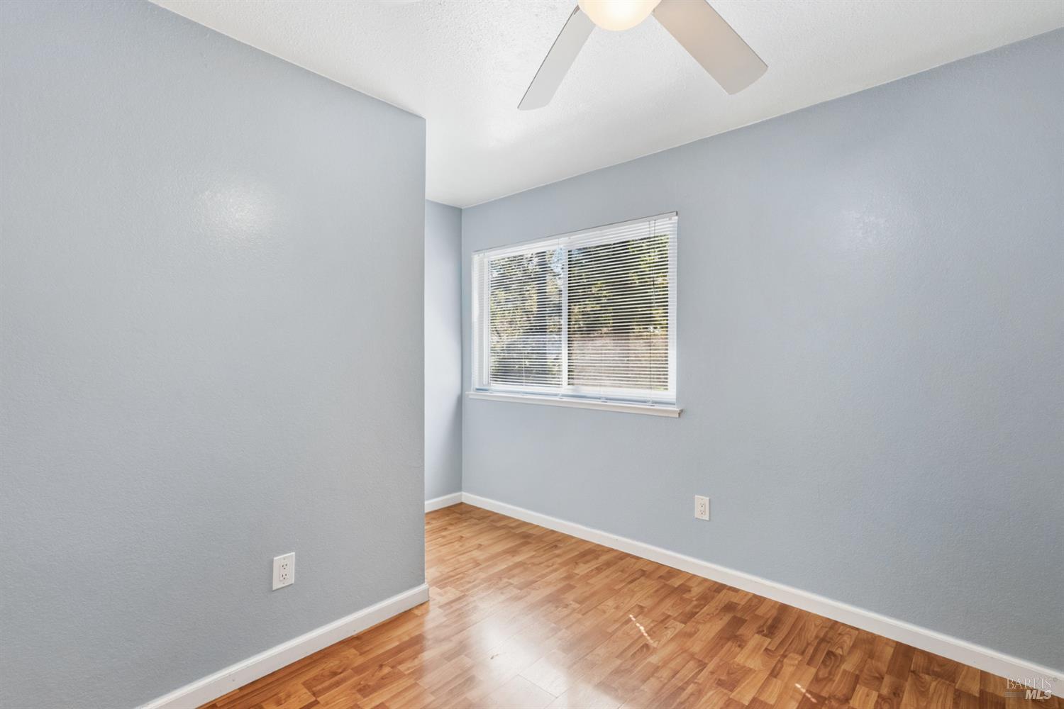 790 Hudis Street Rohnert Park, CA 94928 - Photo 27 of 41 a view of an empty room with wooden floor and a window