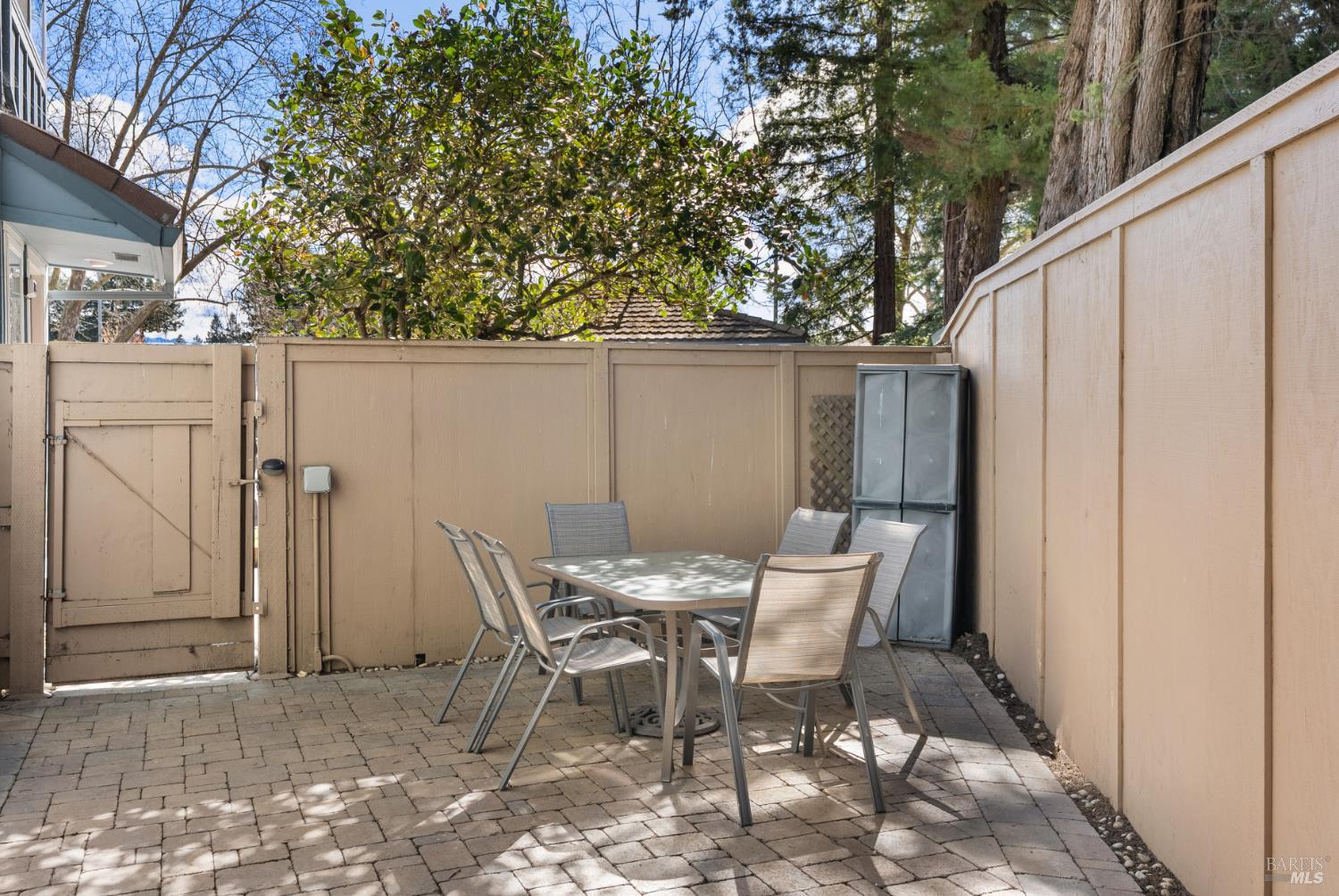 790 Hudis Street Rohnert Park, CA 94928 - Photo 37 of 41 a view of a patio with table and chairs and wooden fence