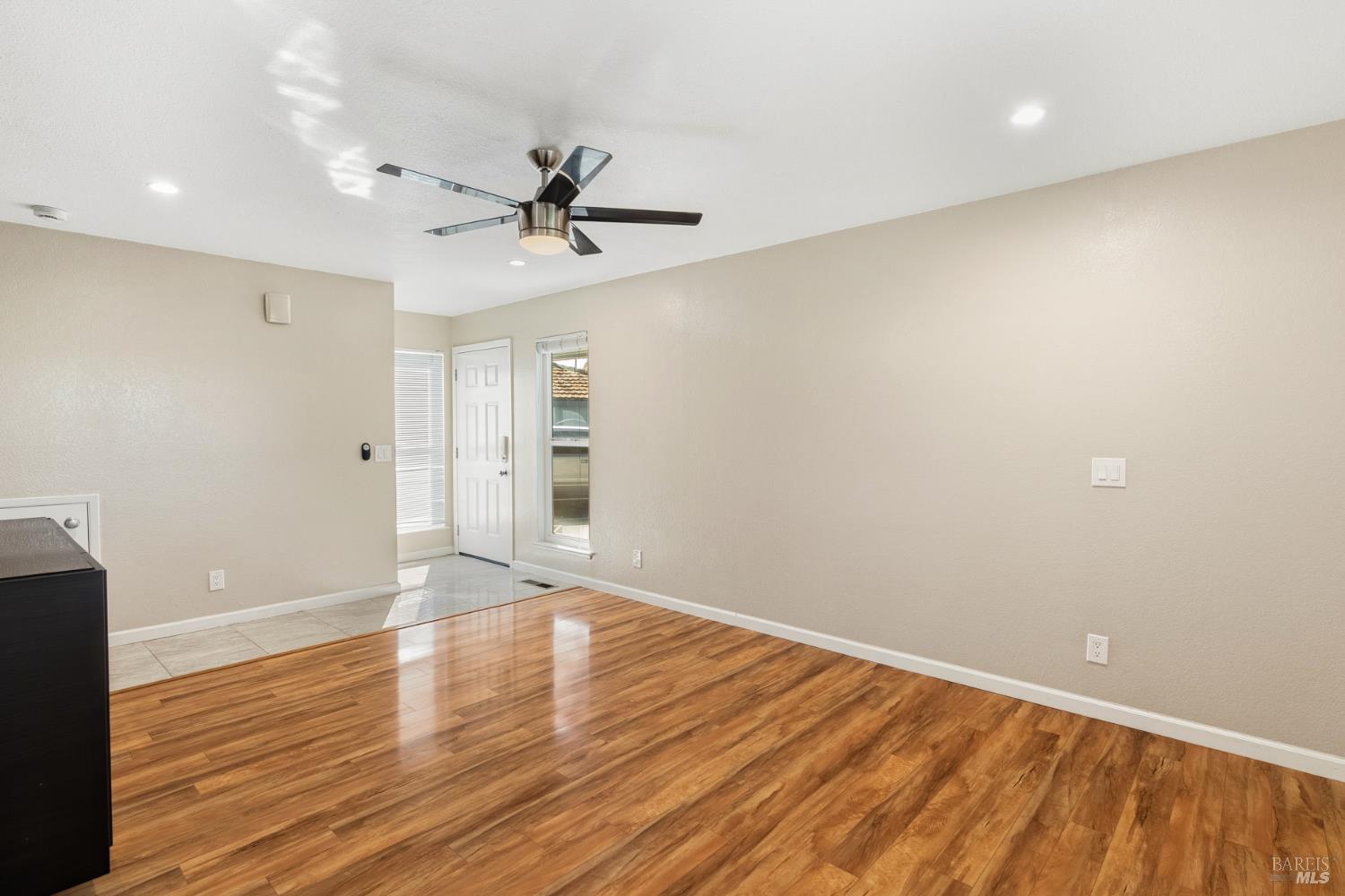 790 Hudis Street Rohnert Park, CA 94928 - Photo 9 of 41 a view of empty room with wooden floor and fan