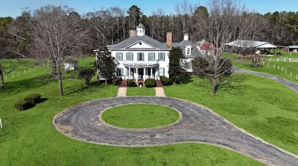 a view of a house with a garden