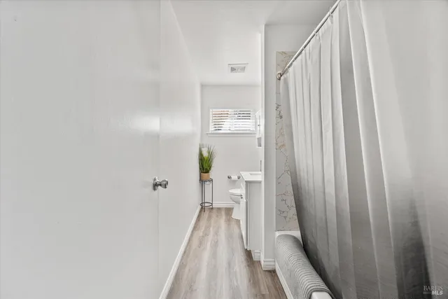 a view of a bedroom from a hallway