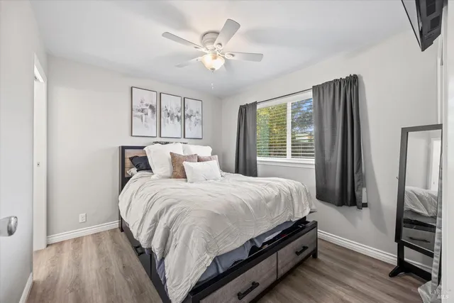 a bedroom with a bed and a window