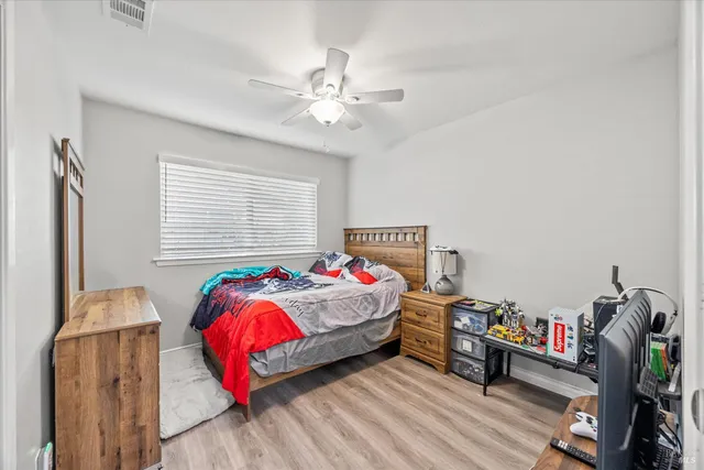 a bedroom with furniture and a bed