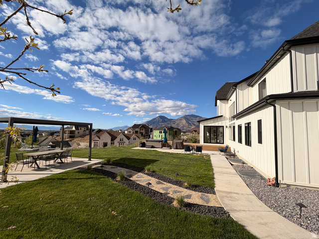 3626 Riverstone Road Mapleton, UT 84664 - Photo 51 of 58 View of grassy yard with a patio area and a mountain view