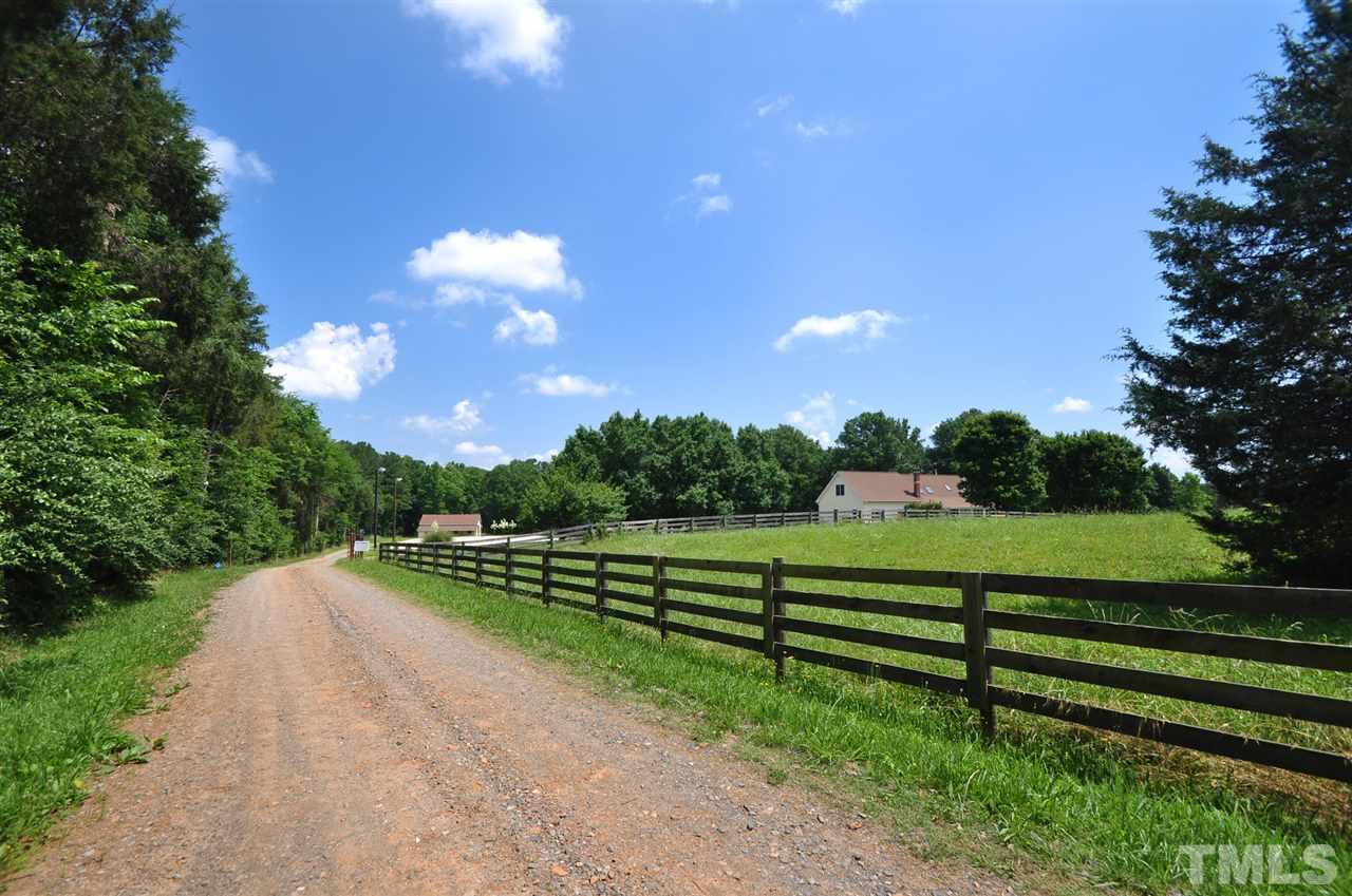 738 Castle Rock Farm Road Pittsboro, NC 27312 - Photo 2 of 25 a view of a golf course with a lake view
