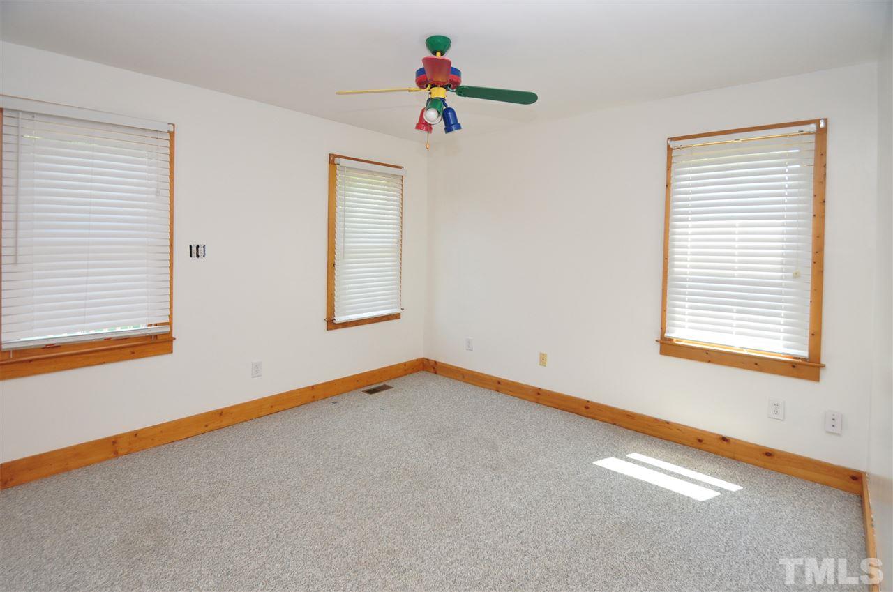 738 Castle Rock Farm Road Pittsboro, NC 27312 - Photo 14 of 25 a view of an empty room with a window