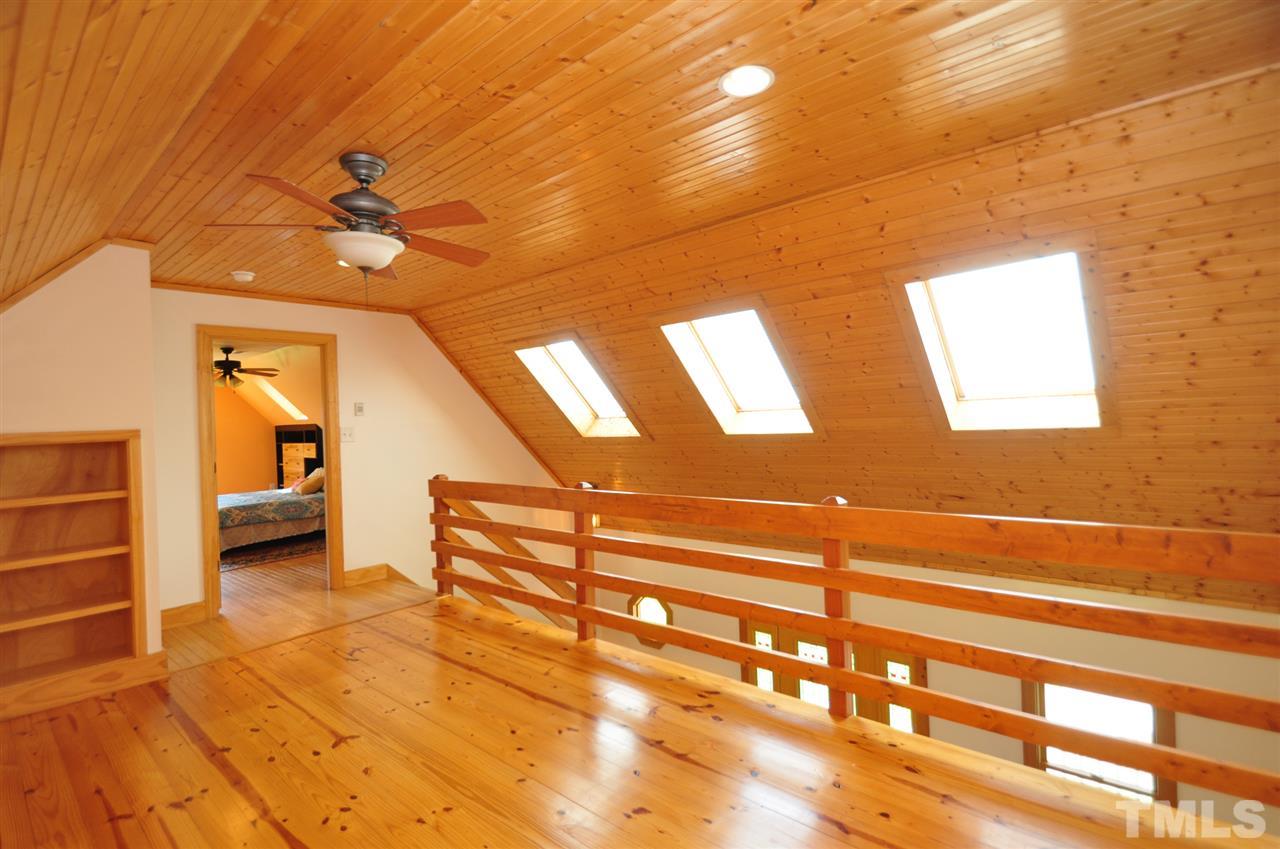 738 Castle Rock Farm Road Pittsboro, NC 27312 - Photo 17 of 25 a view of an empty room with a window