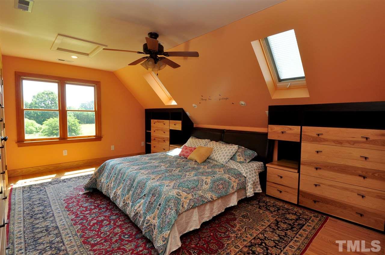 738 Castle Rock Farm Road Pittsboro, NC 27312 - Photo 18 of 25 a bedroom with a bed and a window