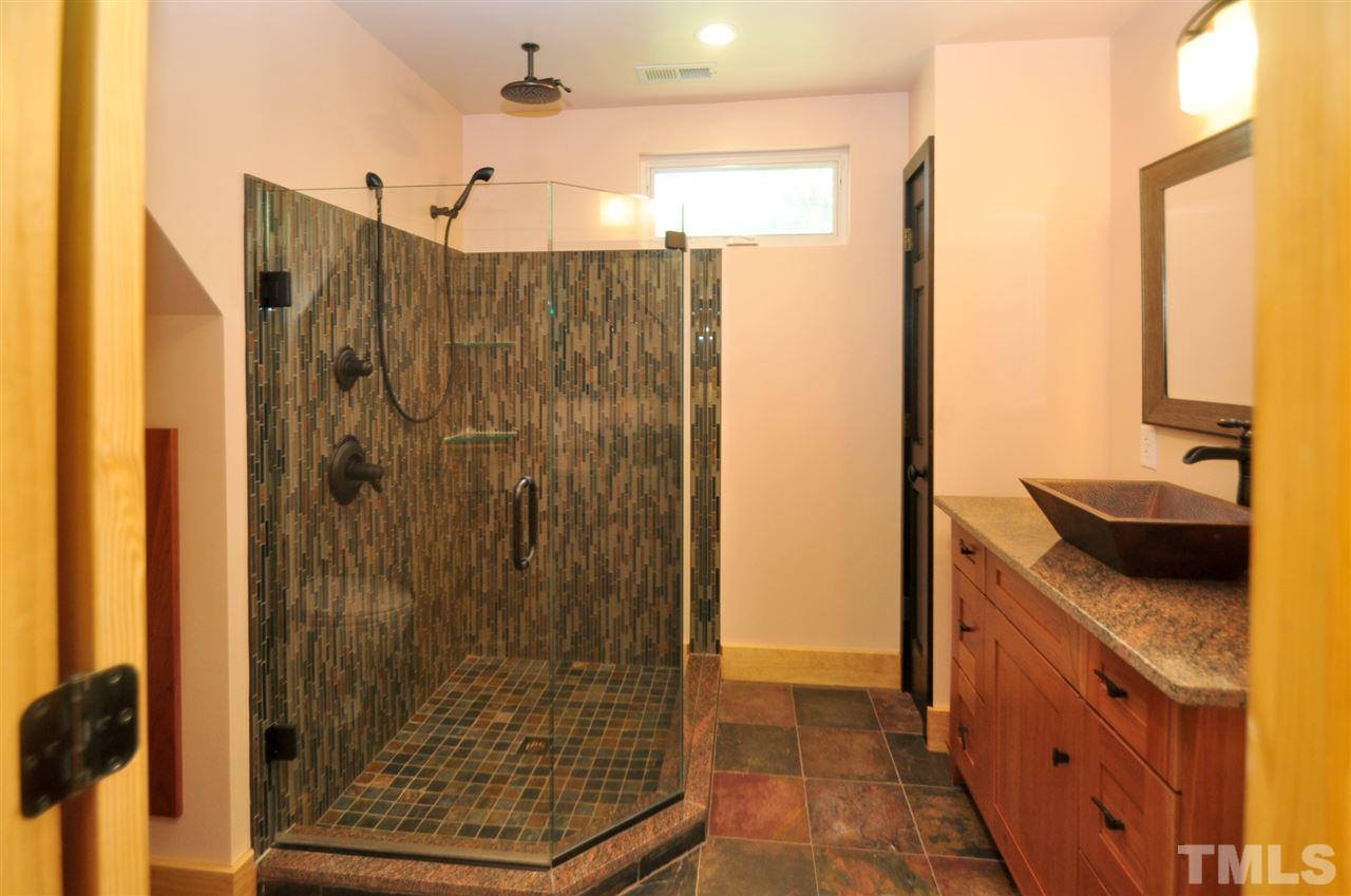 738 Castle Rock Farm Road Pittsboro, NC 27312 - Photo 20 of 25 a bathroom with a shower and a sink