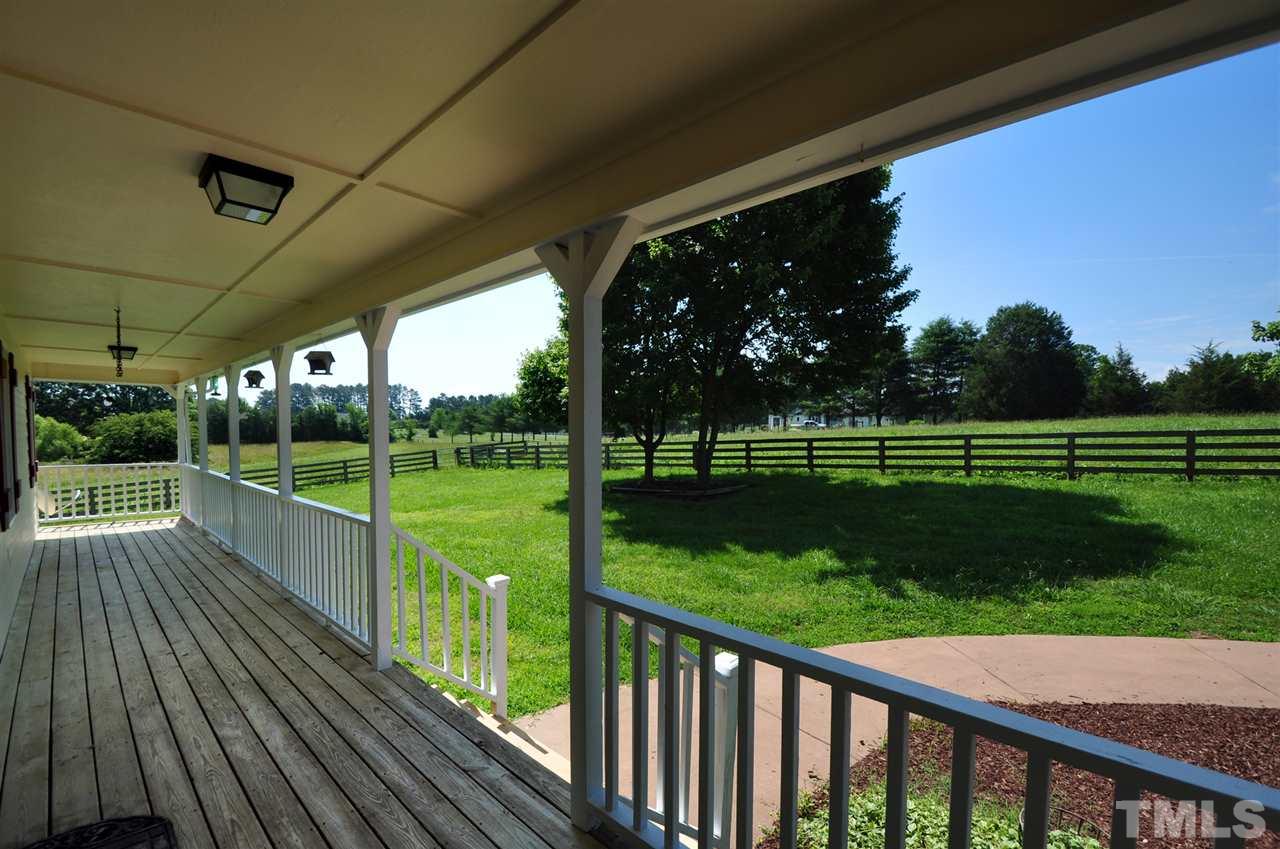738 Castle Rock Farm Road Pittsboro, NC 27312 - Photo 3 of 25 a view of a deck with a big yard