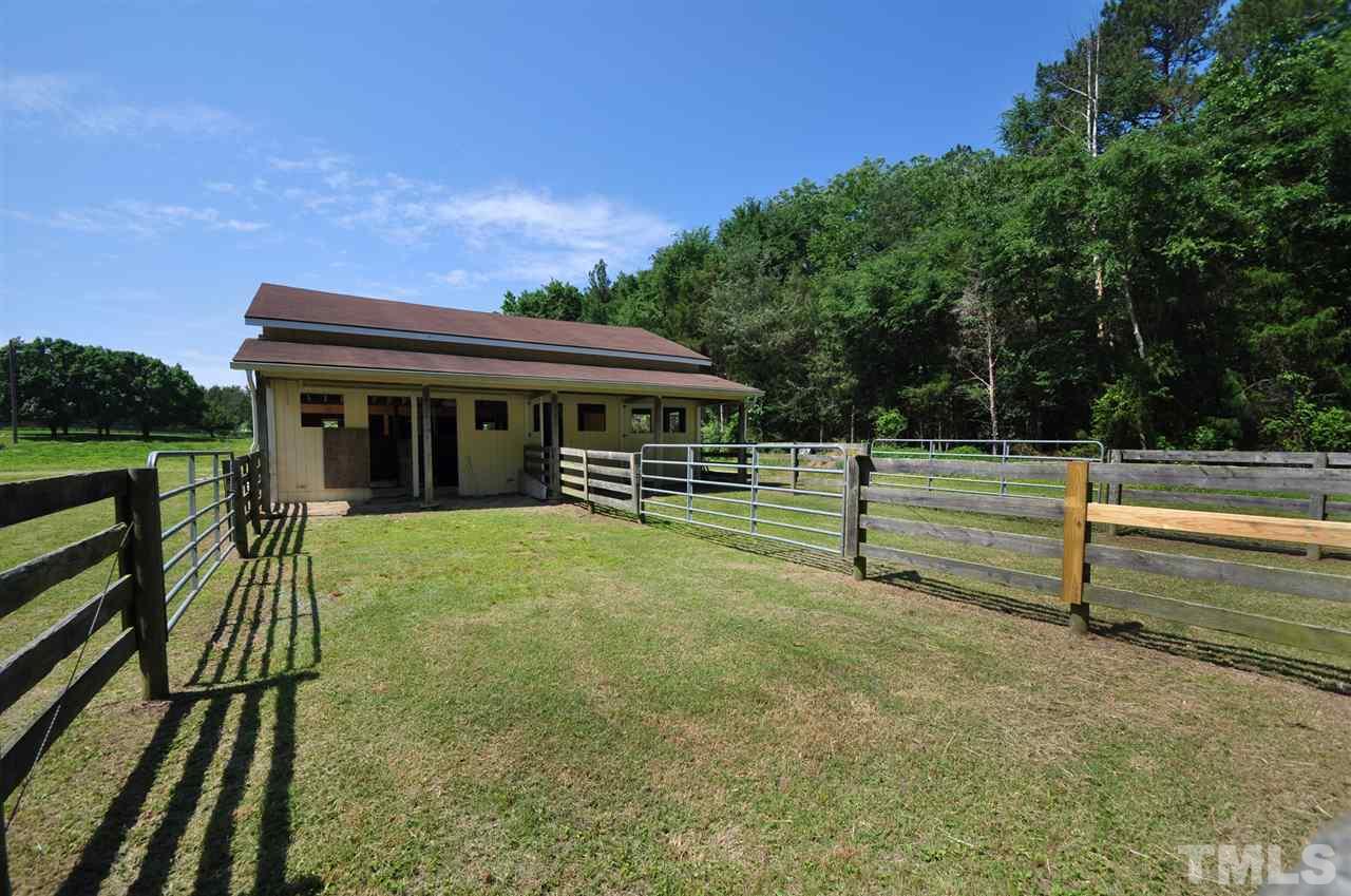738 Castle Rock Farm Road Pittsboro, NC 27312 - Photo 22 of 25 a view of a house with backyard and sitting area