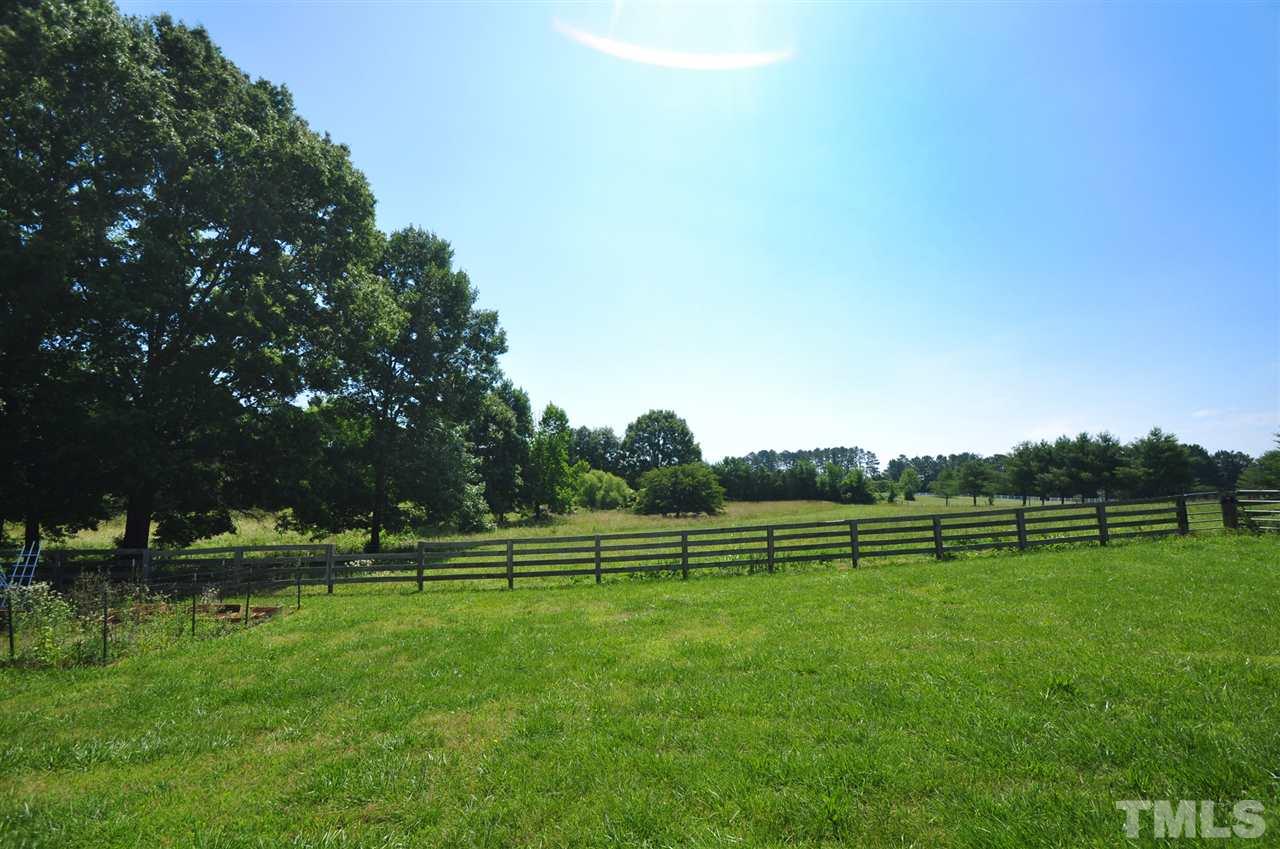 738 Castle Rock Farm Road Pittsboro, NC 27312 - Photo 24 of 25 a view of outdoor space with deck and trees