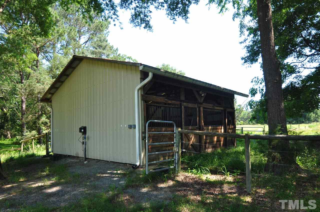 738 Castle Rock Farm Road Pittsboro, NC 27312 - Photo 25 of 25 a front view of a house with garden