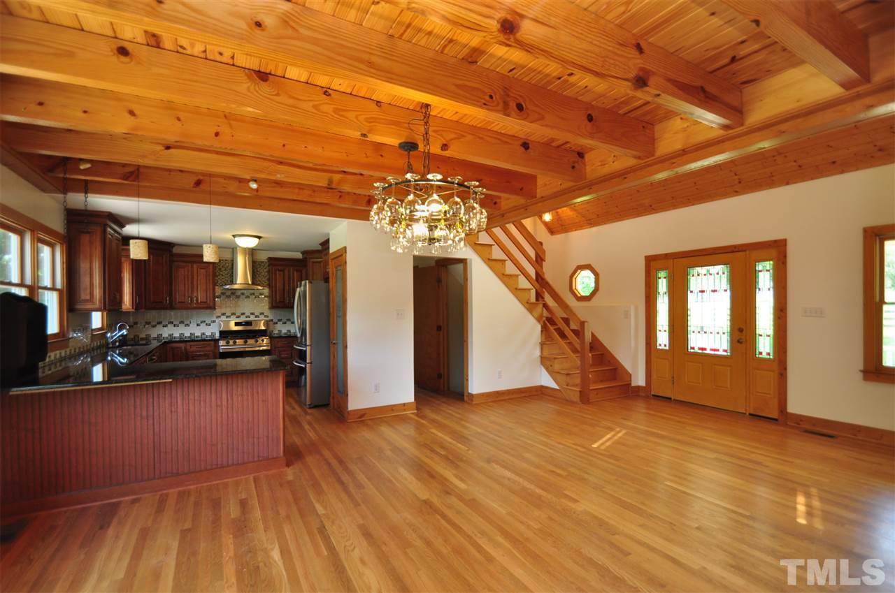 738 Castle Rock Farm Road Pittsboro, NC 27312 - Photo 4 of 25 a view of a room with wooden floor and stairs