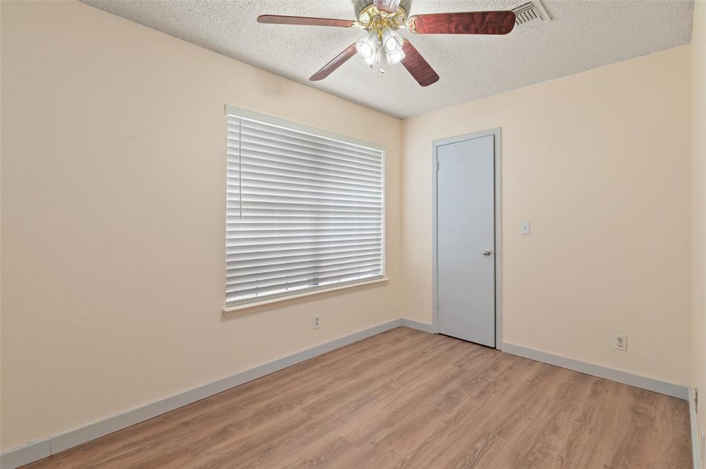 700 West Collins Street Denton, TX 76201 - Photo 25 of 36 1st of three upstairs bedrooms