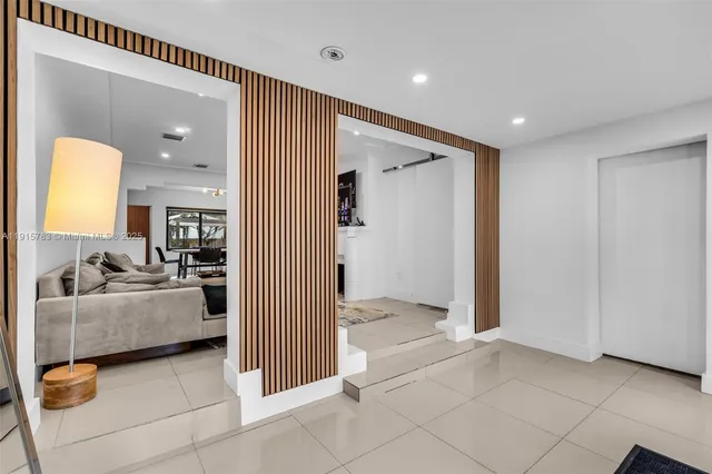 a view of a livingroom with a couch and chandelier