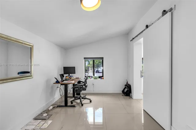 a work room with table and chairs