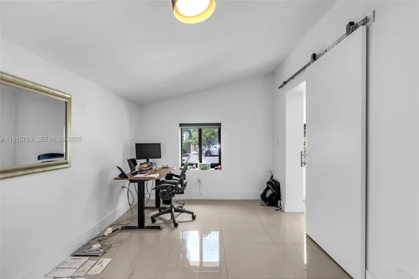 a work room with table and chairs