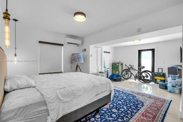 a bed room with a bed a table and a chair