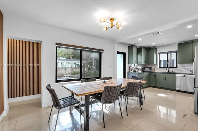 a view of a dining room with furniture and window