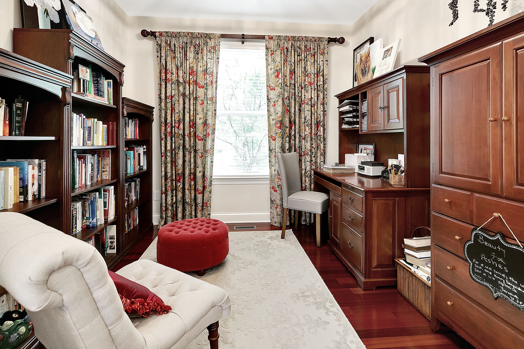 201 Verde Meadow Drive Franklin, TN 37067 - Photo 14 of 40 a living room with furniture a bookshelf and a window