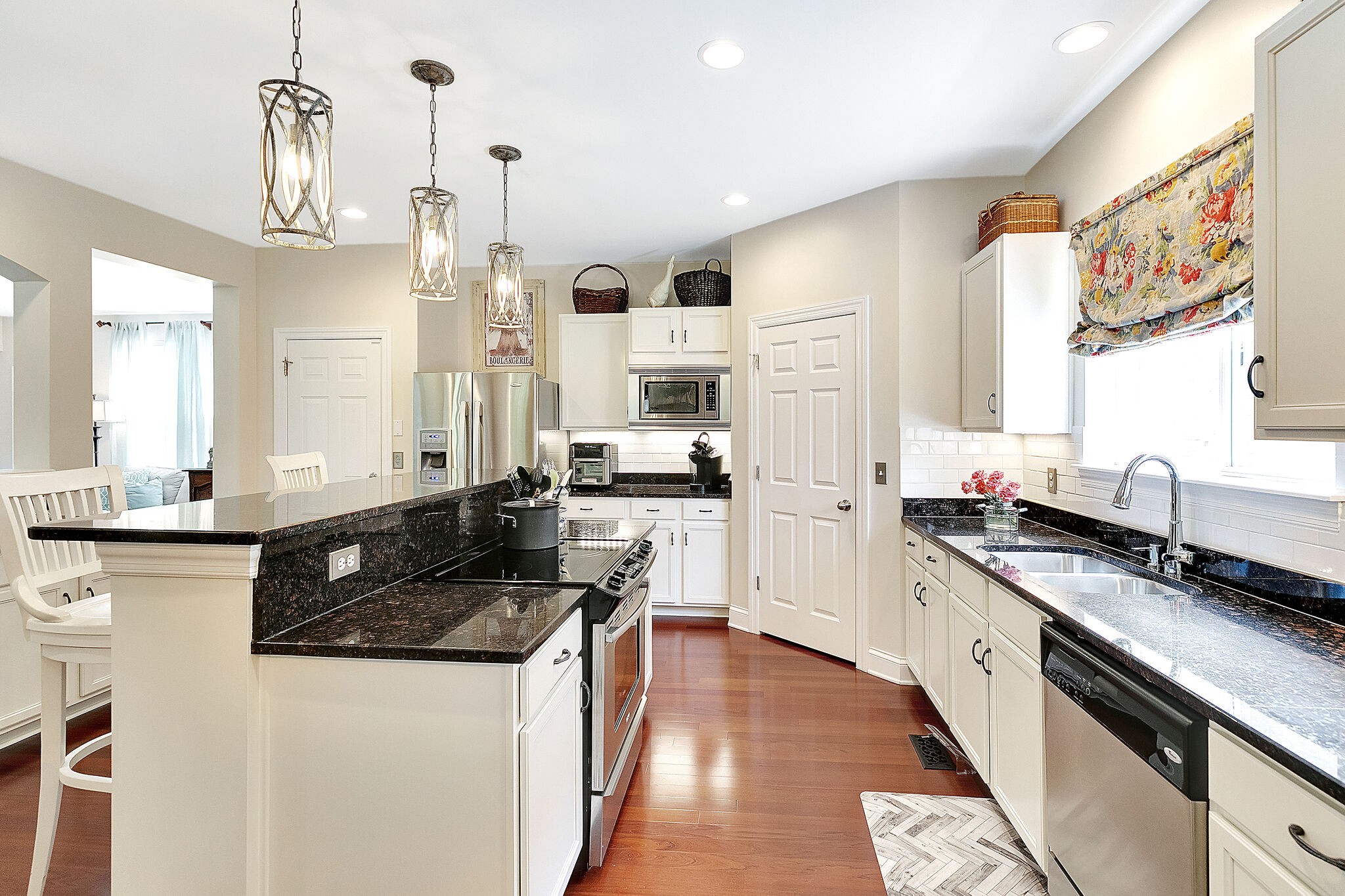 201 Verde Meadow Drive Franklin, TN 37067 - Photo 19 of 40 a kitchen with granite countertop a sink a stove refrigerator and cabinets