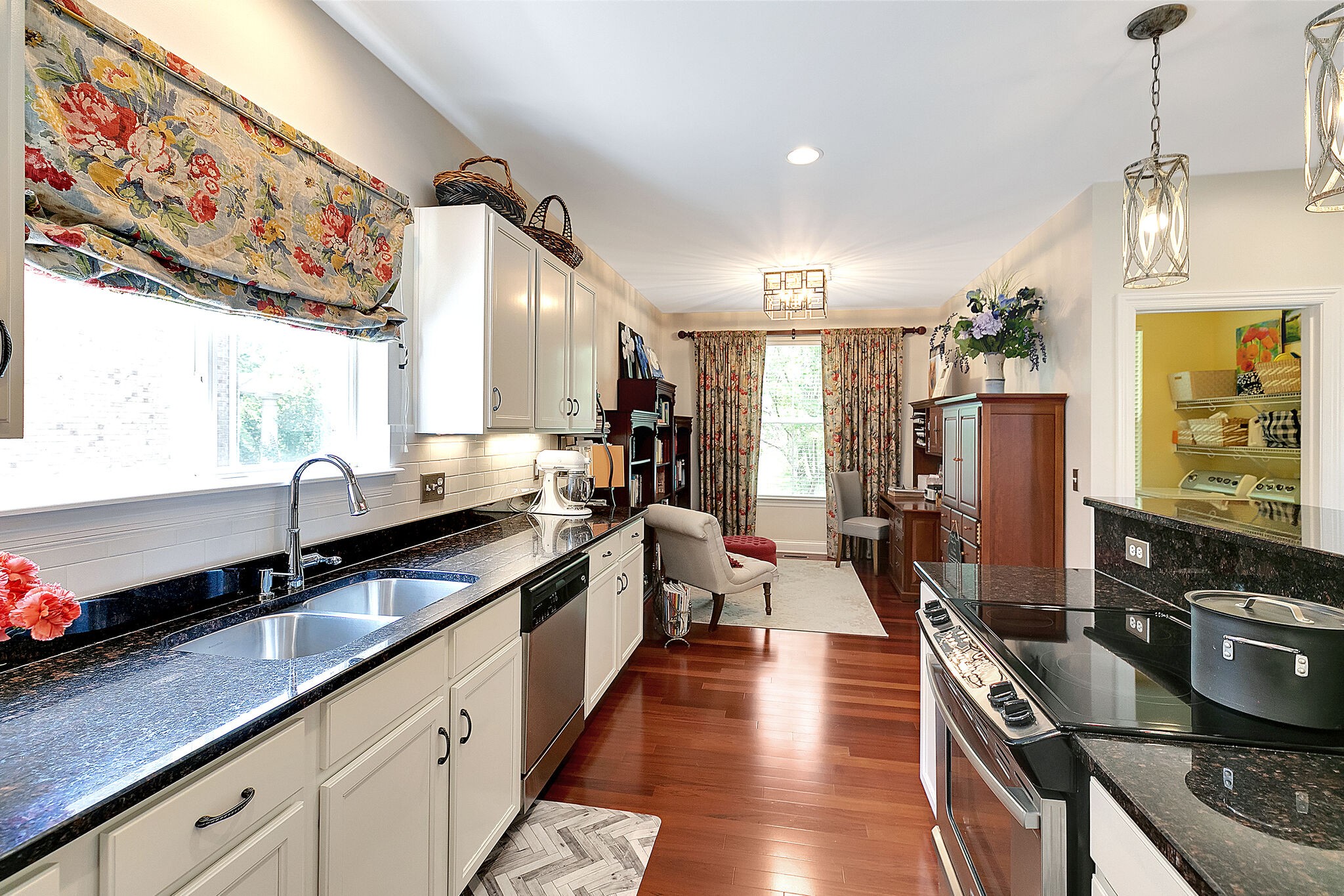 201 Verde Meadow Drive Franklin, TN 37067 - Photo 20 of 40 a large kitchen with stainless steel appliances a stove a sink dishwasher and cabinets with wooden floor