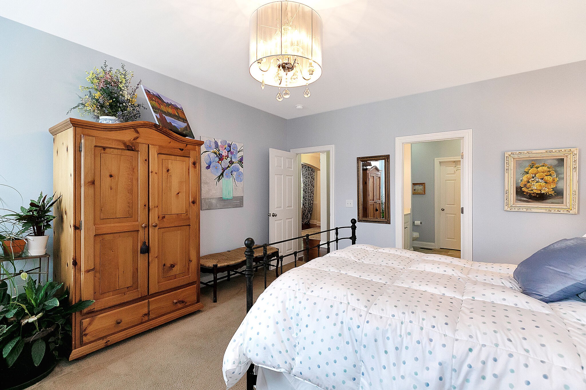 201 Verde Meadow Drive Franklin, TN 37067 - Photo 24 of 40 a bedroom with a bed and a chandelier