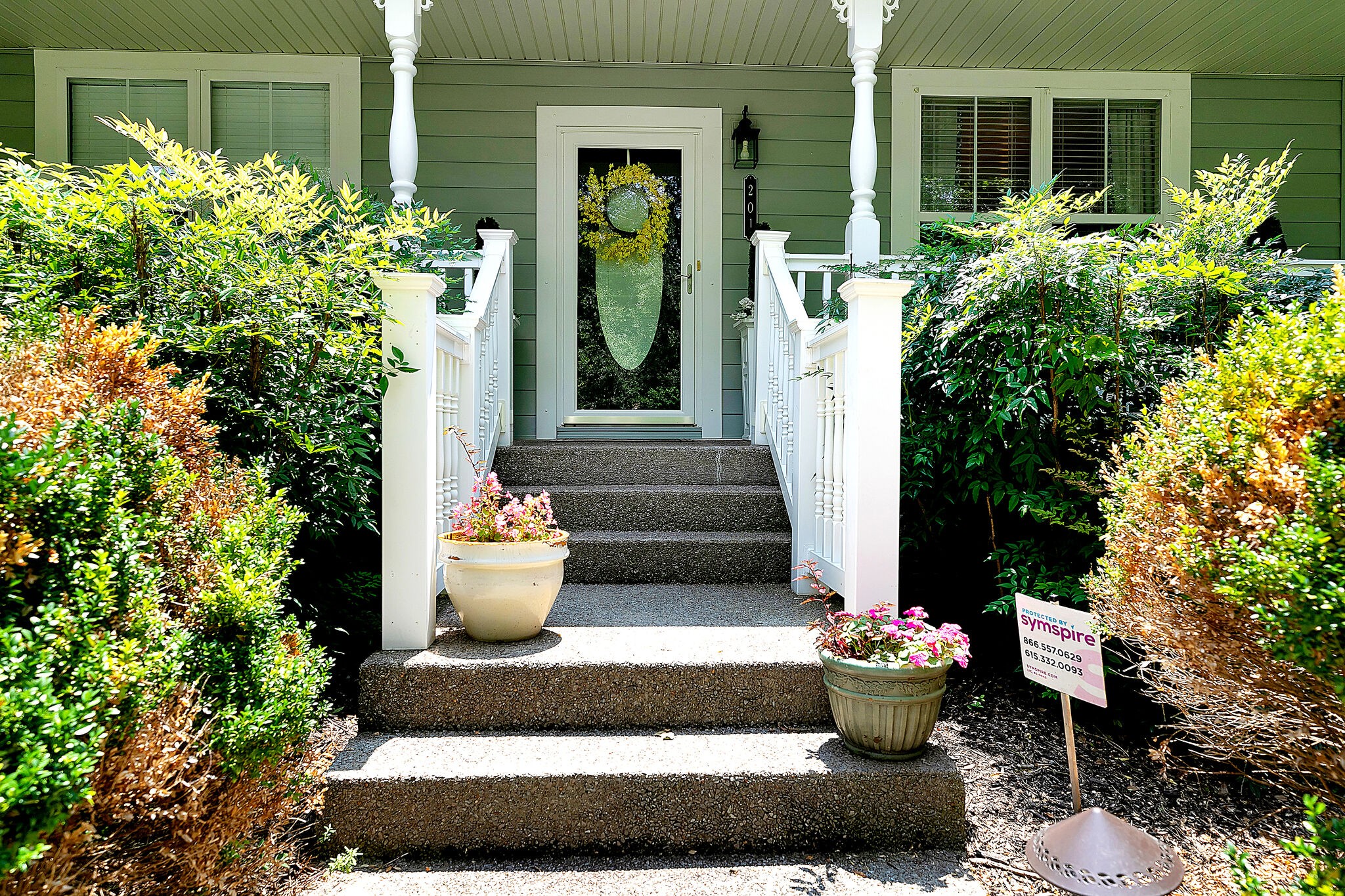 201 Verde Meadow Drive Franklin, TN 37067 - Photo 3 of 40 a front view of a house with outdoor seating