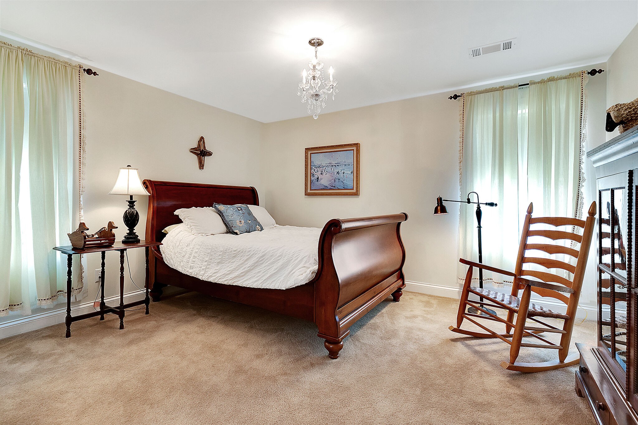 201 Verde Meadow Drive Franklin, TN 37067 - Photo 32 of 40 a bedroom with a bed and a chandelier