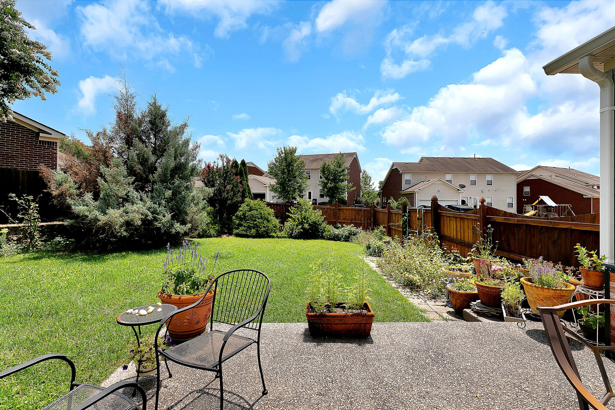 201 Verde Meadow Drive Franklin, TN 37067 - Photo 35 of 40 a view of a chairs and table in a garden