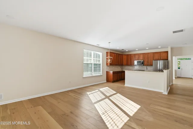 an aerial view of a house with a swimming pool and garden