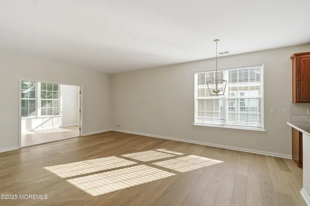 an aerial view of a house with a swimming pool outdoor seating and yard