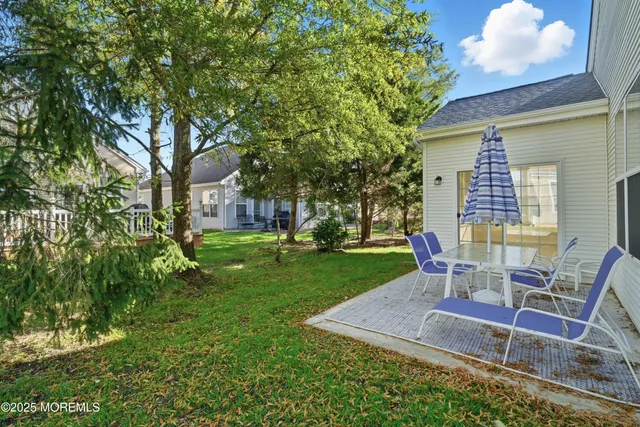 a kitchen with granite countertop a sink stainless steel appliances and cabinets
