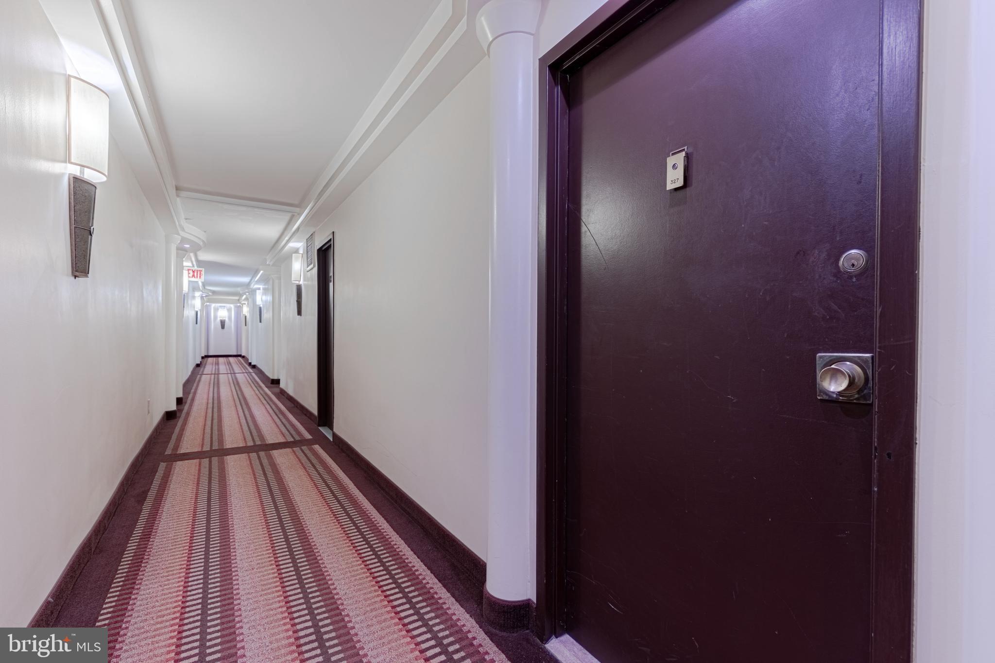 950 25th Street Northwest, Unit 327N Washington, DC 20037 - Photo 2 of 29 a view of a hallway with wooden floor and staircase