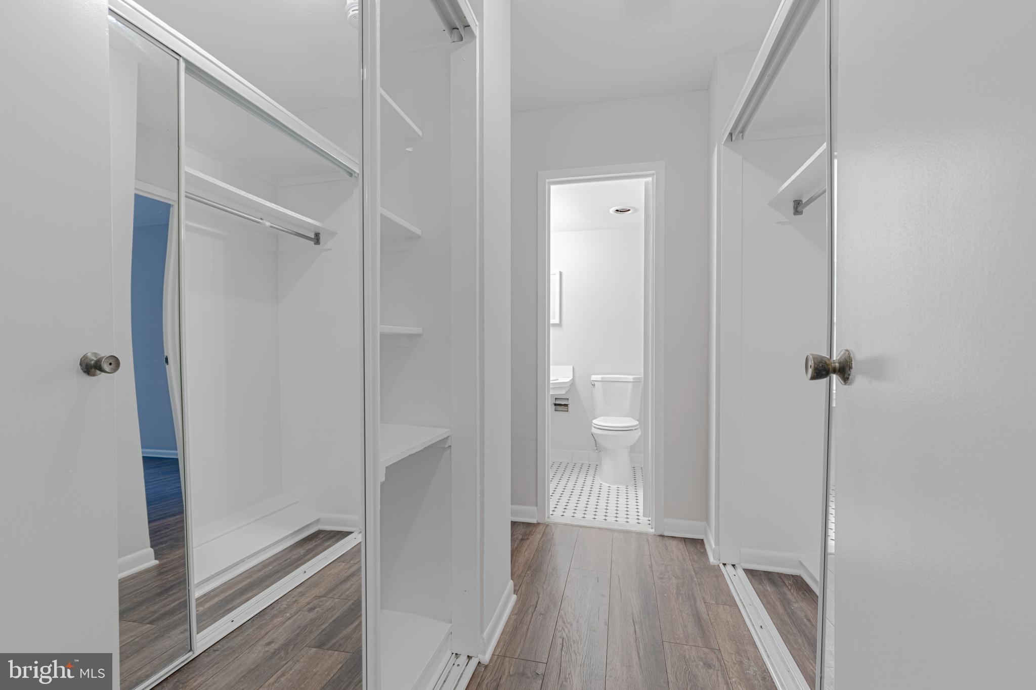 950 25th Street Northwest, Unit 327N Washington, DC 20037 - Photo 10 of 29 a view of a hallway with a glass door and closet
