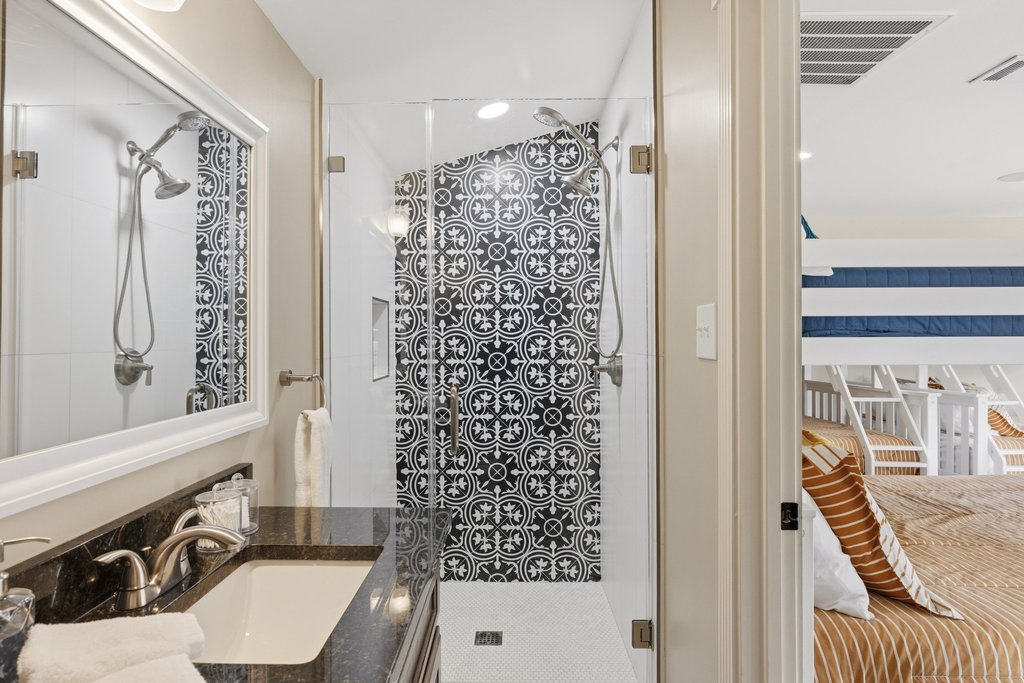 12135 Fitzhugh Road Austin, TX 78736 - Photo 20 of 30 a bathroom with a sink toilet and shower