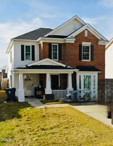 a front view of a house with swimming pool