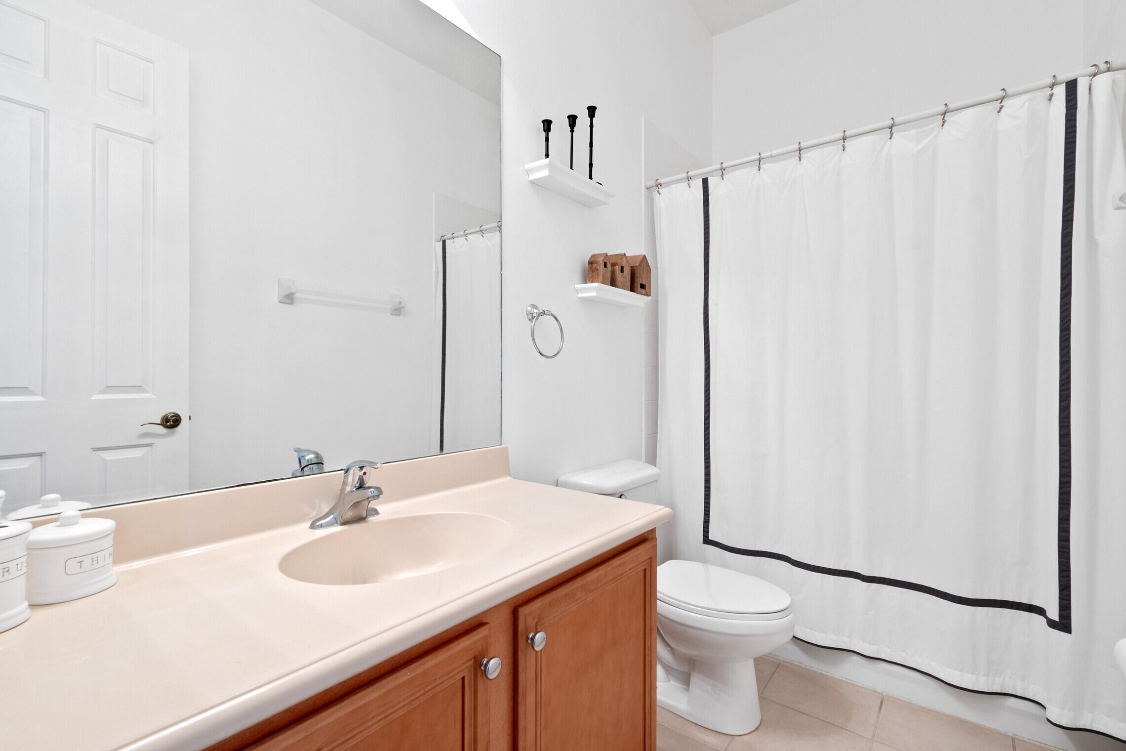 151 Mulligan Place Jupiter, FL 33458 - Photo 11 of 23 a bathroom with a sink a toilet and shower