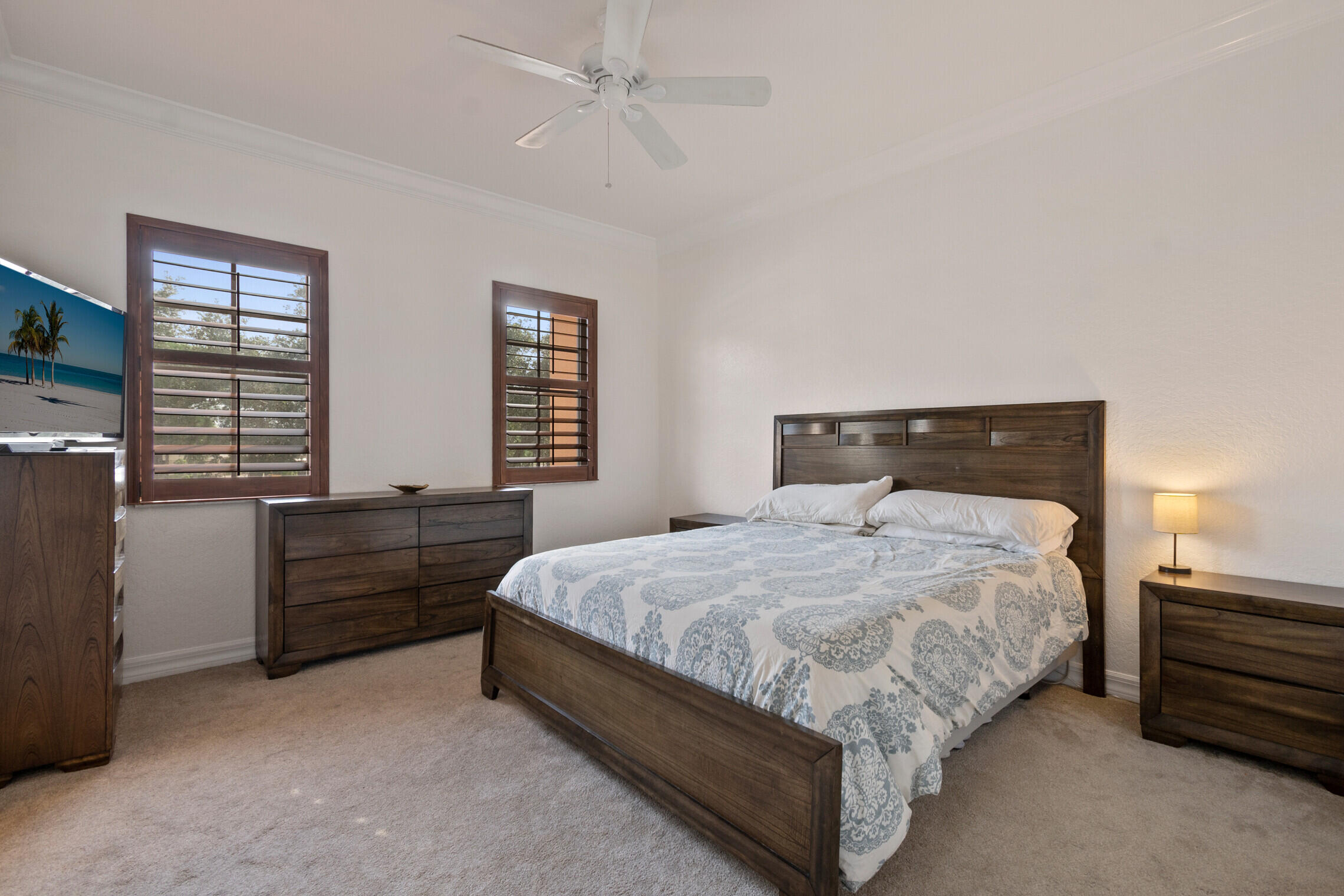 151 Mulligan Place Jupiter, FL 33458 - Photo 12 of 23 a bedroom with a bed and windows