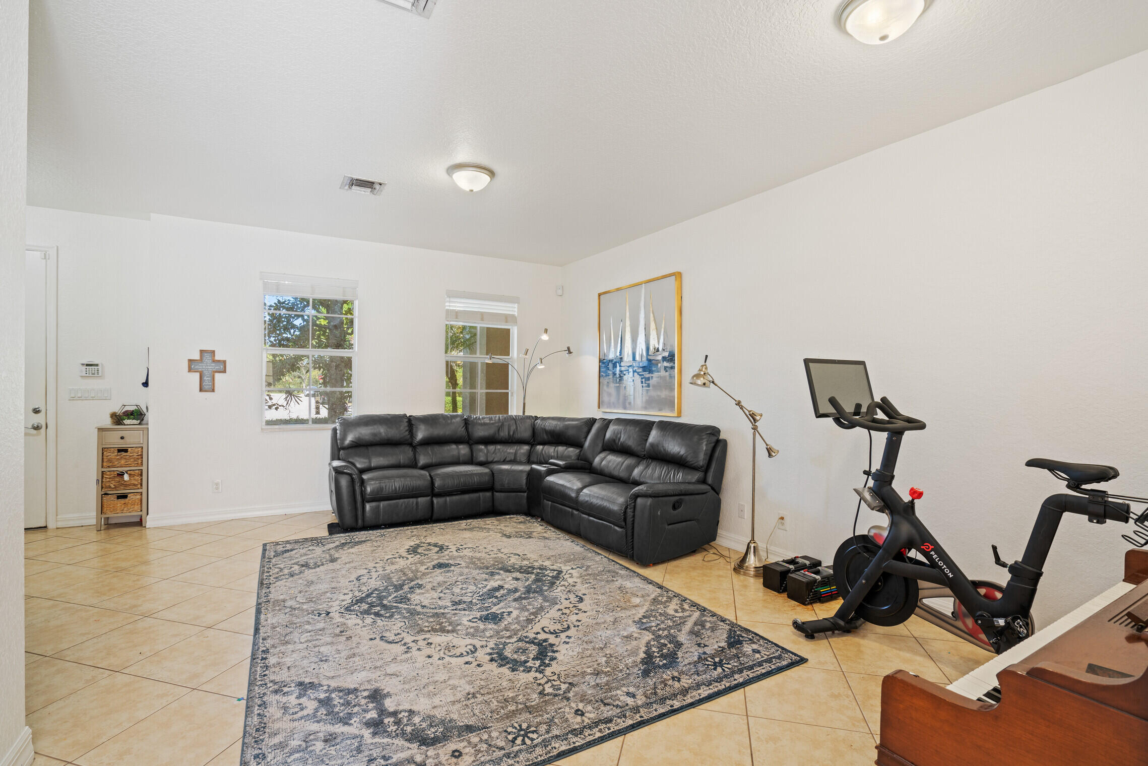 151 Mulligan Place Jupiter, FL 33458 - Photo 5 of 23 a living room with furniture and a wooden floor