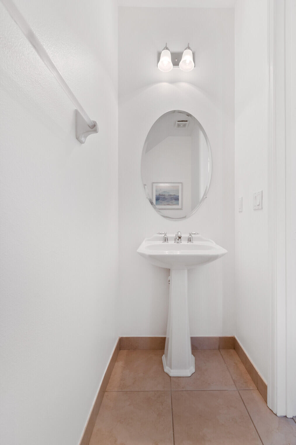 151 Mulligan Place Jupiter, FL 33458 - Photo 8 of 23 a bathroom with a sink and mirror