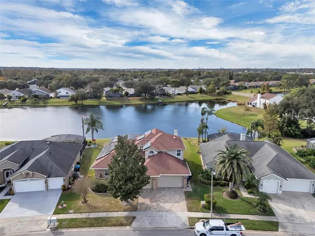 an aerial view of a house with a lake view