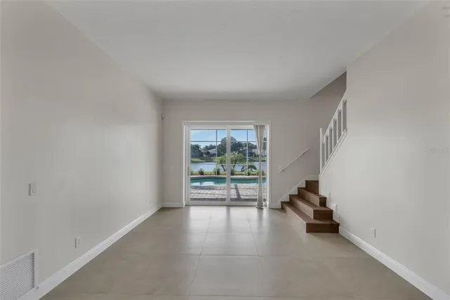 a view of empty room with windows