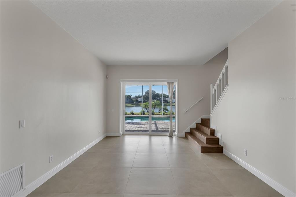 2626 Raccoon Run Lane Orlando, FL 32837 - Photo 14 of 62 an empty room with windows