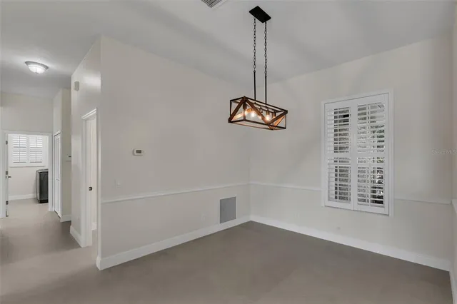 a kitchen with stainless steel appliances granite countertop a refrigerator sink stove and oven