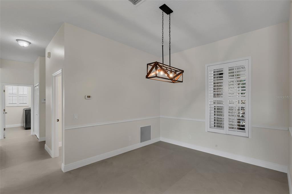 2626 Raccoon Run Lane Orlando, FL 32837 - Photo 16 of 62 a view of empty room with windows