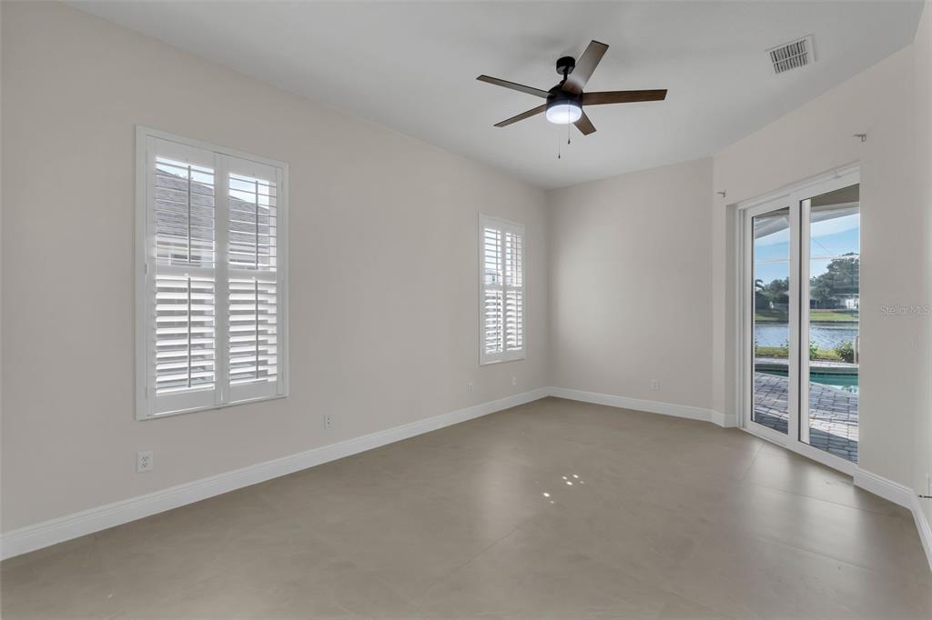 2626 Raccoon Run Lane Orlando, FL 32837 - Photo 23 of 62 a view of a livingroom with a ceiling fan and window