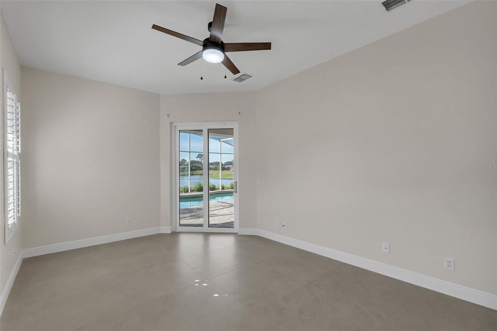 2626 Raccoon Run Lane Orlando, FL 32837 - Photo 24 of 62 wooden floor in an empty room with a window